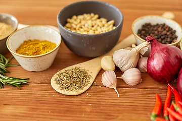 Image showing spices, onion, garlic, pine nuts and chili peppers
