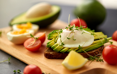 Image showing toast bread with avocado, eggs and cherry tomatoes