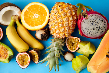 Image showing different exotic fruits on blue background