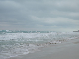 Image showing turquoise tropical ocean and dark sky