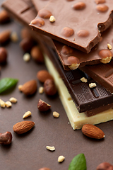 Image showing close up of different chocolate bars and nuts