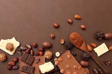 Image showing chocolate with nuts, cocoa beans and powder