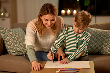 Image showing mother and son with pencils drawing at home