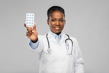 Image showing african american female doctor with medicine pills