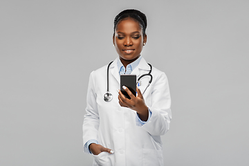 Image showing african american female doctor with smartphone