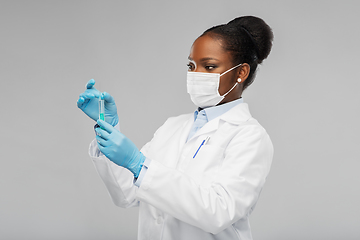 Image showing african american female doctor with syringe