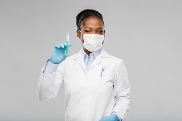 Image showing african american female doctor with syringe