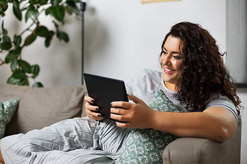 Image showing woman with tablet pc computer on sofa at home