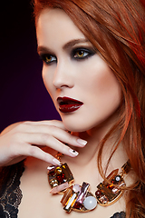 Image showing beautiful girl with bright makeup and red hair