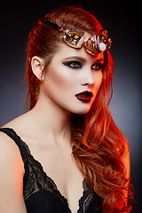 Image showing beautiful girl with bright makeup and red hair