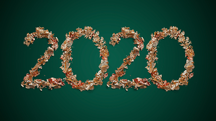 Image showing New Year wishes and 2020 made of golden leaves on green backgrou