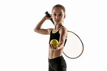 Image showing Little caucasian girl playing tennis isolated on white background