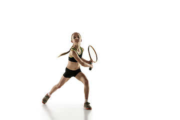 Image showing Little caucasian girl playing tennis isolated on white background