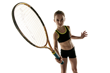 Image showing Little caucasian girl playing tennis isolated on white background
