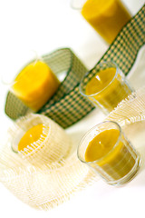 Image showing five yellow candles and ribbon