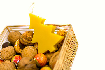 Image showing walnuts, sweets and handmade candle