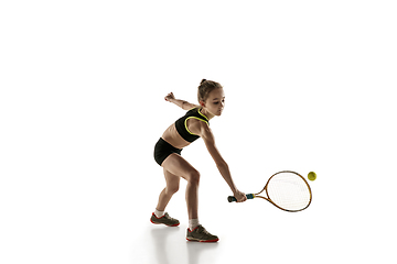 Image showing Little caucasian girl playing tennis isolated on white background