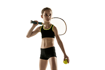 Image showing Little caucasian girl playing tennis isolated on white background