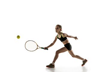 Image showing Little caucasian girl playing tennis isolated on white background