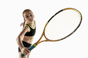 Image showing Little caucasian girl playing tennis isolated on white background