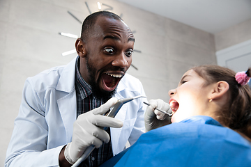 Image showing Young caucasian girl visiting dentist\'s office