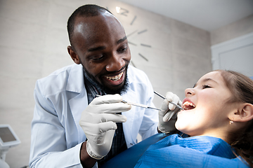 Image showing Young caucasian girl visiting dentist\'s office