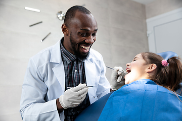 Image showing Young caucasian girl visiting dentist\'s office