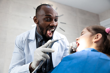 Image showing Young caucasian girl visiting dentist\'s office