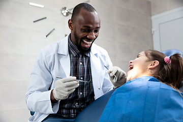 Image showing Young caucasian girl visiting dentist\'s office