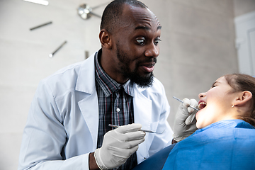 Image showing Young caucasian girl visiting dentist\'s office