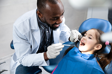 Image showing Young caucasian girl visiting dentist\'s office