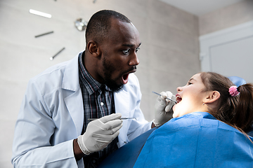 Image showing Young caucasian girl visiting dentist\'s office