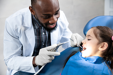 Image showing Young caucasian girl visiting dentist\'s office