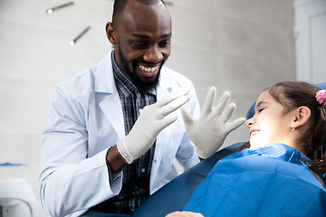 Image showing Young caucasian girl visiting dentist\'s office