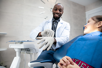 Image showing Young caucasian girl visiting dentist\'s office