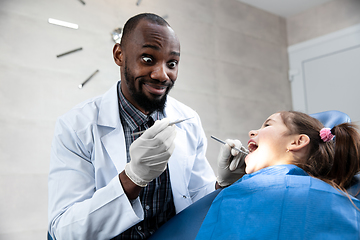 Image showing Young caucasian girl visiting dentist\'s office, smiling