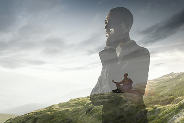 Image showing Silhouette of businessman with landscapes on background, double exposure.