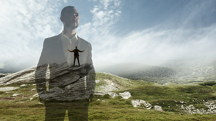 Image showing Silhouette of businessman with landscapes on background, double exposure.