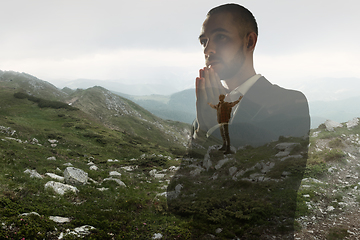 Image showing Silhouette of businessman with landscapes on background, double exposure.