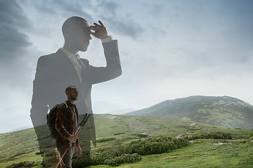 Image showing Silhouette of businessman with landscapes on background, double exposure.