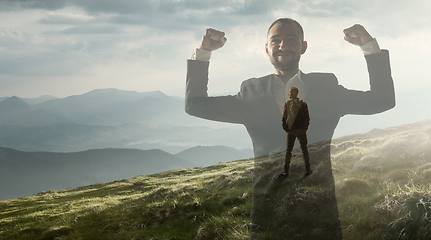 Image showing Silhouette of businessman with landscapes on background, double exposure.