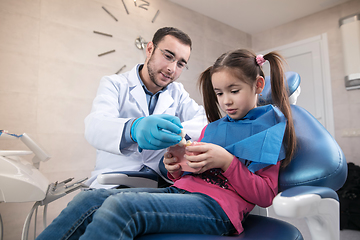 Image showing Young caucasian girl visiting dentist\'s office