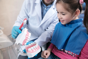 Image showing Young caucasian girl visiting dentist\'s office