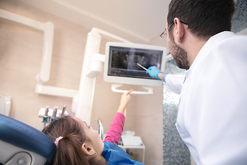 Image showing Young caucasian girl visiting dentist\'s office