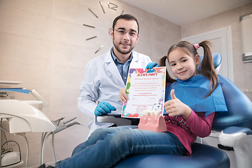 Image showing Young caucasian girl visiting dentist\'s office