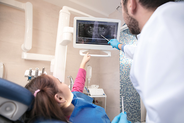 Image showing Young caucasian girl visiting dentist\'s office