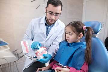 Image showing Young caucasian girl visiting dentist\'s office