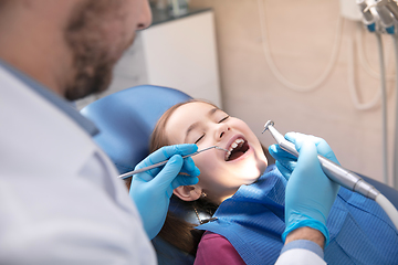 Image showing Young caucasian girl visiting dentist\'s office