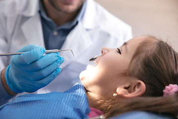 Image showing Young caucasian girl visiting dentist\'s office