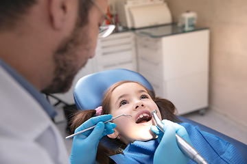 Image showing Young caucasian girl visiting dentist\'s office